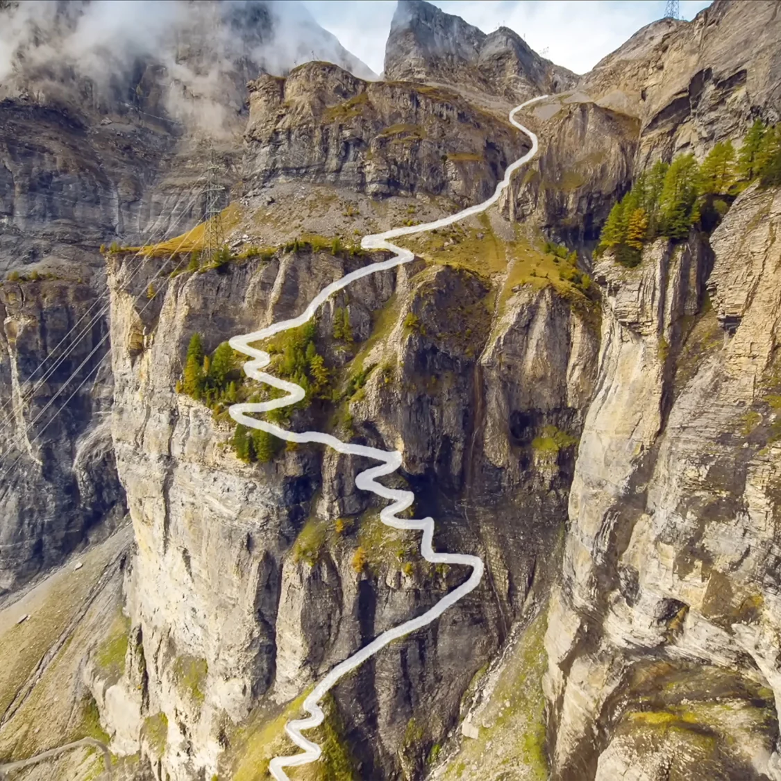 The steep Gemmiweg switchbacks climbing a sheer alpine rock wall